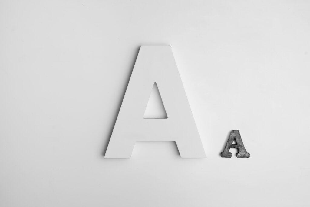 Bold Typography -In the image, there are 2 Letter As - One is in bold and big style and other one is in small size.